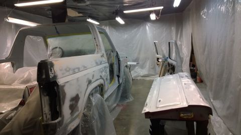 1983 Ford Bronco - This 1983 Ford Bronco is being prepped for paint in a spray booth, showing its bodywork in progress.