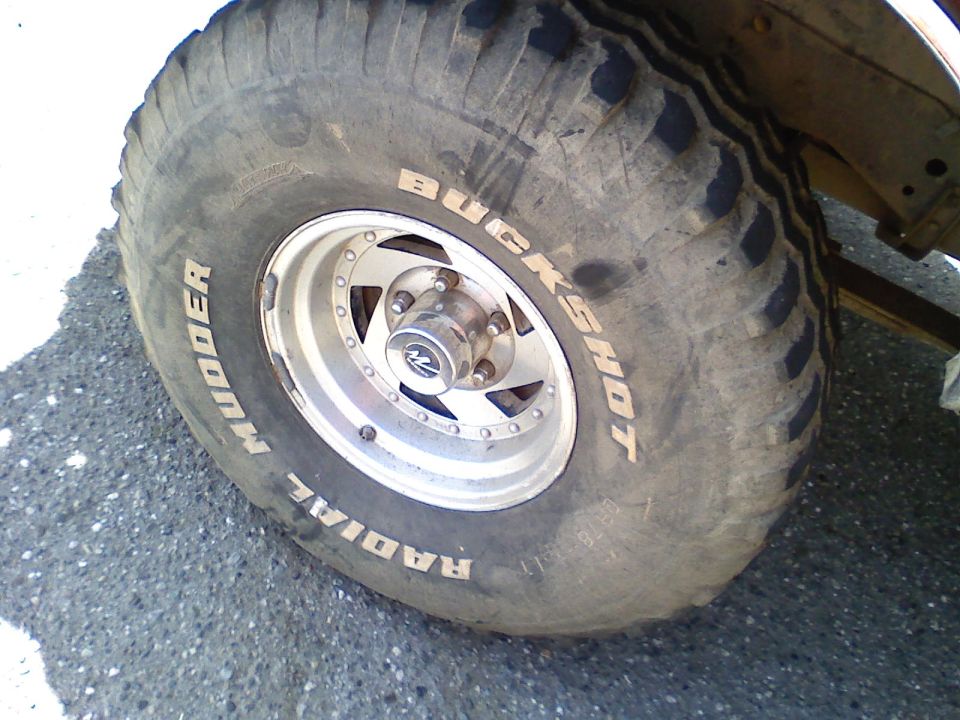 Mudder Buckshot radial tire on a silver rim