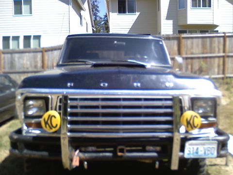 1979 Ford Bronco - Front view of a 1979 Ford Bronco, its distinctive grille and KC auxiliary lights.