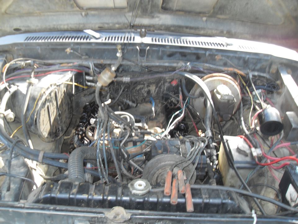 Engine bay with visible wiring and engine components