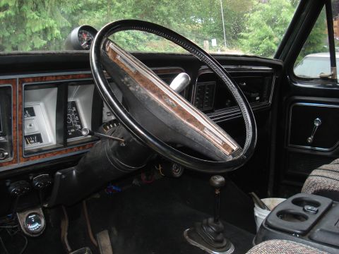 1979 Ford Bronco - Interior view of a 1979 Ford Bronco, highlighting the dashboard and steering wheel.