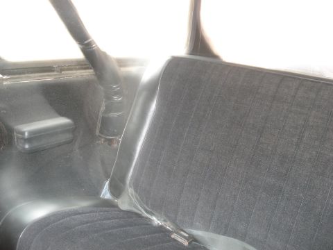 1979 Ford Bronco - Interior view of a vehicle, focusing on the seat and a roll bar.