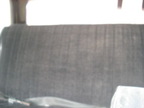 1979 Ford Bronco - The interior of a vehicle, focusing on the seat upholstery.