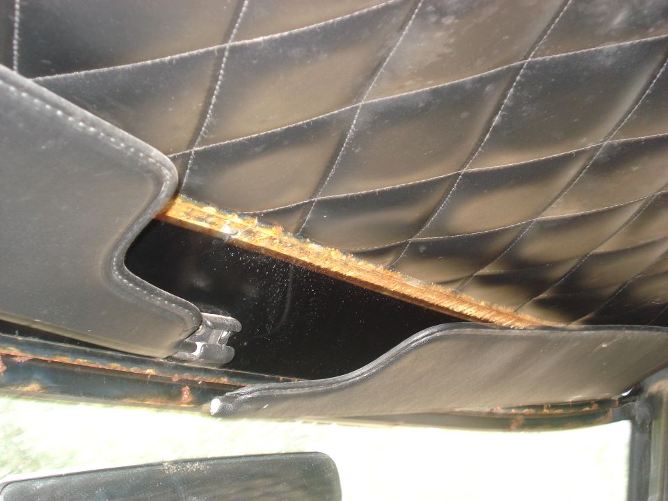 Interior headliner with diamond stitching and exposed wood trim