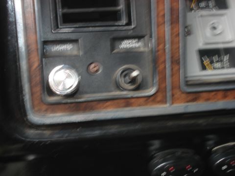 1979 Ford Bronco - Close-up of a vehicle's dashboard interior, showing controls and gauges.