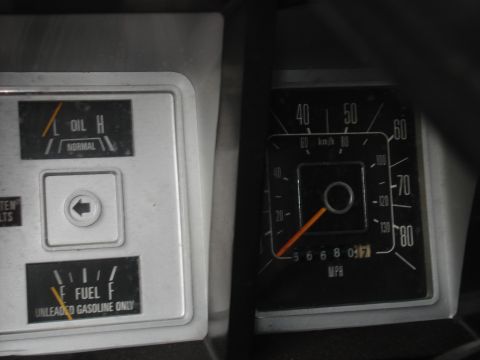 1979 Ford Bronco - Interior view of a 1979 Ford Bronco's dashboard, displaying oil, fuel, and speed gauges.