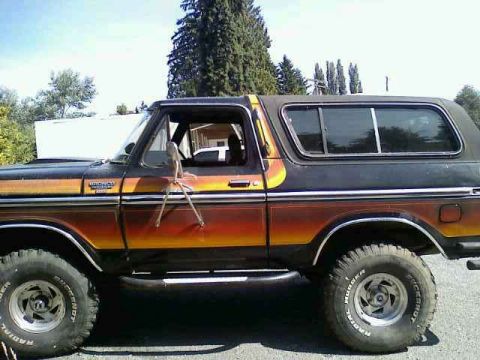 1979 Ford Bronco - Ford Bronco from the late 1970s features a distinctive two-tone paint job with a gradient effect.