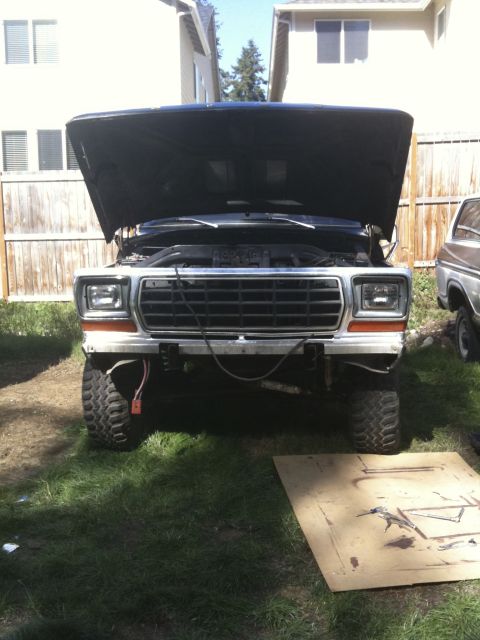 1979 Ford Bronco - Front view of a 1978 Ford Bronco with its hood open, parked outdoors.