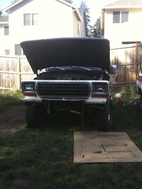1979 Ford Bronco - This 1979 Ford Bronco is shown from the front with its hood raised, revealing the engine compartment.