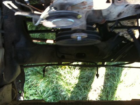 1979 Ford Bronco - Close-up view of engine pulleys and belts, taken from below.