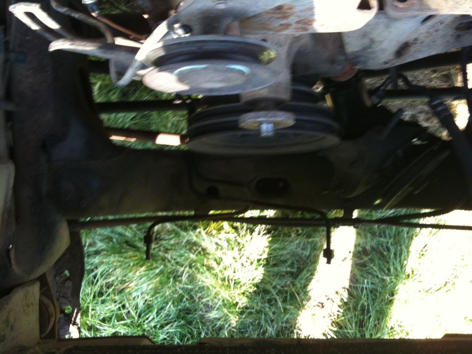 Engine pulleys and belts visible from underneath