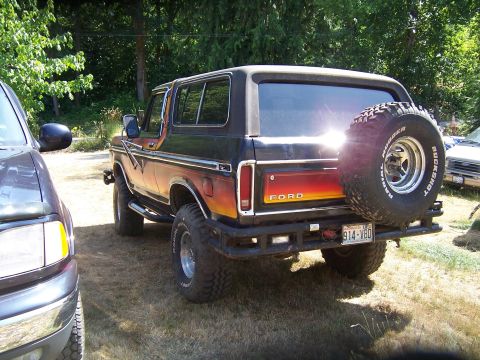 1979 Ford Bronco - Rear view of a 1979 Ford Bronco with aftermarket bumper and spare tire mounted.