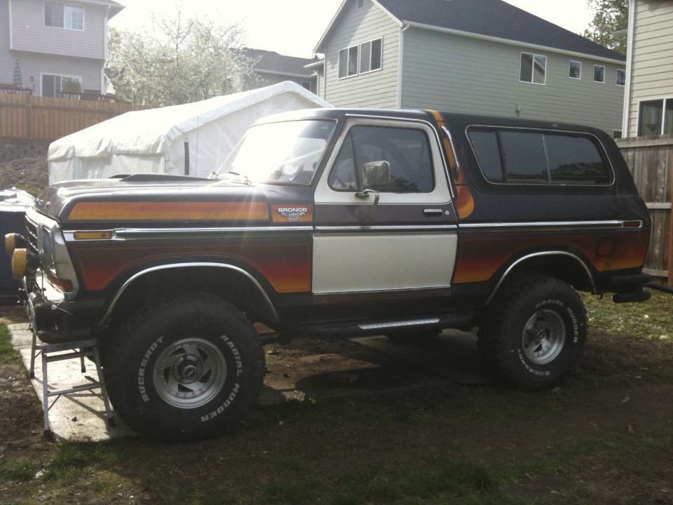 1979 Ford Bronco side view with wood paneling and racing stripes