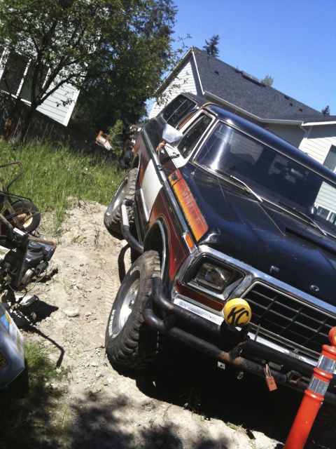 1979 Ford Bronco - This Ford Bronco features a distinctive two-tone paint scheme with wood grain accents along the side.