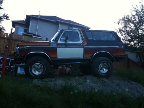 1979 Ford Bronco - Side profile of a 1979 Ford Bronco with a distinctive two-tone paint scheme.