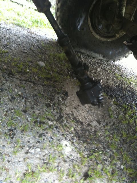 1979 Ford Bronco - Close-up view of a vehicle's driveshaft and differential, showing mechanical components.