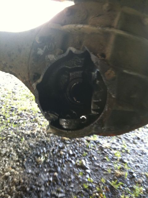 1979 Ford Bronco - The differential housing appears to have sustained significant damage, exposing internal components.