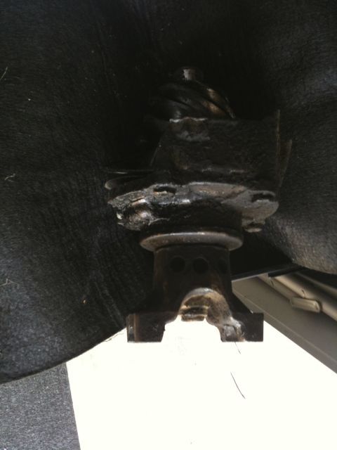 1979 Ford Bronco - Close-up view of a driveshaft U-joint assembly, likely from a vehicle's drivetrain.