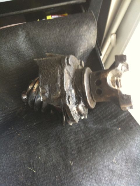 1979 Ford Bronco - Differential carrier with a severely damaged ring gear and yoke, likely from a Ford Bronco.