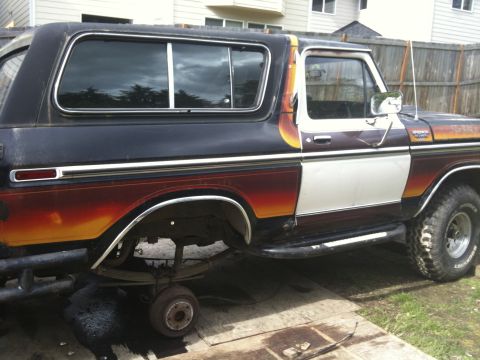 1979 Ford Bronco - This 1978 Ford Bronco is missing its rear wheel and appears to be undergoing repairs or modifications.