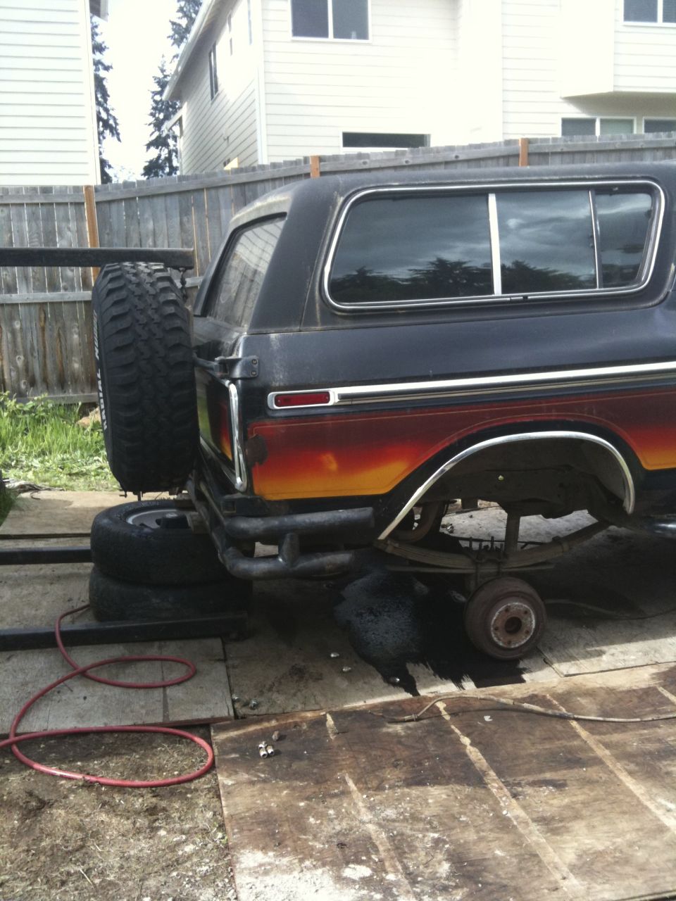 Rear view of a 1979 Ford Bronco with a spare tire and custom bumper