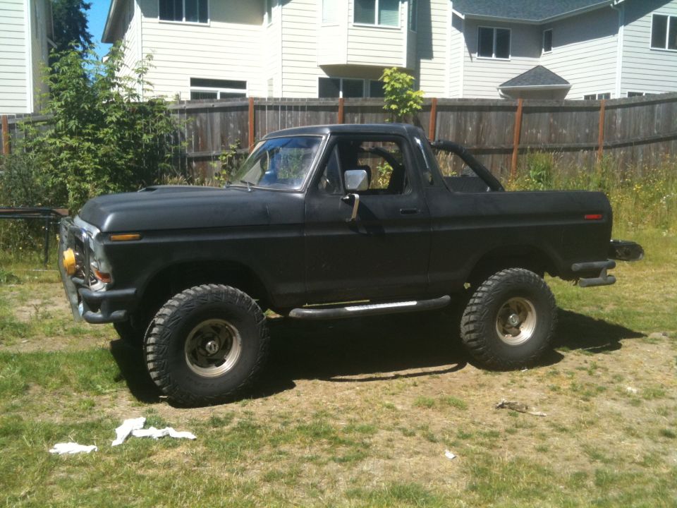 1979 Ford Bronco side view, black with off-road tires