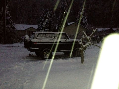 1979 Ford Bronco - A classic Ford Bronco sits covered in snow on a winter day.
