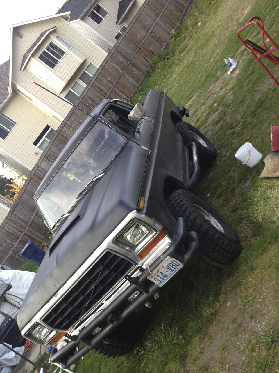 1979 Ford Bronco 3q-front view, black with off-road tires and custom bumper