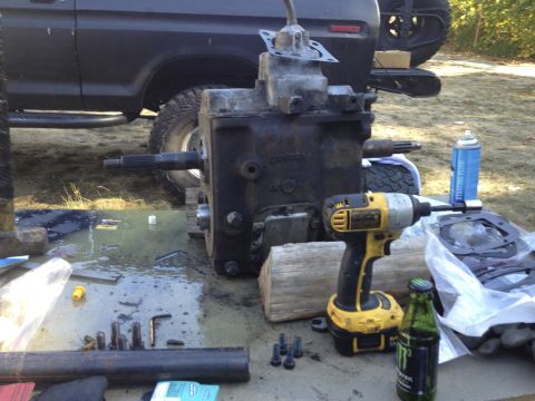 1979 Ford Bronco - Transmission and tools are laid out on a table, with a truck in the background.