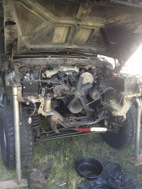 1979 Ford Bronco - Front end of a 1979 Ford Bronco disassembled, showing the engine and suspension components.