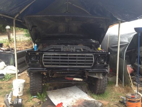 1979 Ford Bronco - This 1979 Ford Bronco is undergoing some work with its hood up and front end exposed.