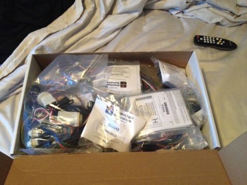 1979 Ford Bronco - A box containing various automotive wiring harnesses from American Autowire is shown, with part numbers visible on the packaging.