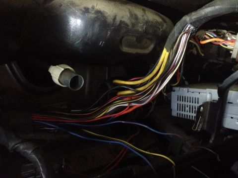 1979 Ford Bronco - A complex wiring harness and audio equipment are shown within the vehicle's interior.