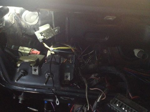 1979 Ford Bronco - Close-up view of a complex vehicle wiring harness, showing numerous wires and connectors.