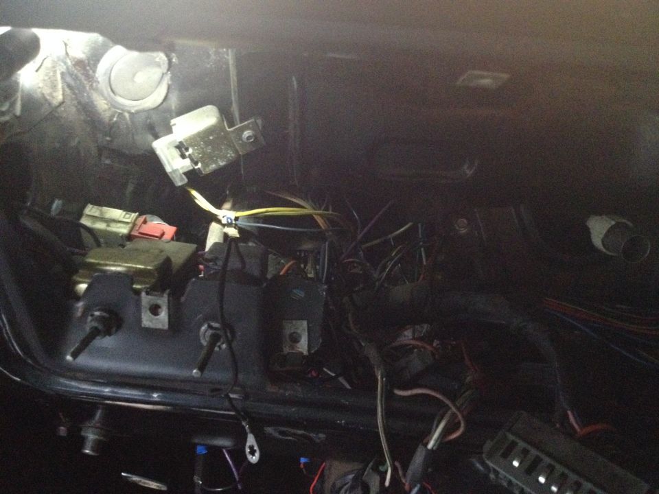 Vehicle interior wiring harness with exposed wires and electrical components