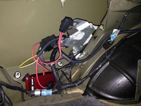 2002 Ford Mustang - Close-up view of aftermarket automotive electrical components and wiring.