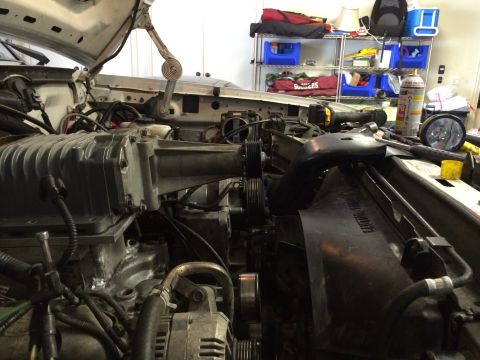 1996 Ford Bronco - Close-up view of an engine bay, highlighting a prominent supercharger installation.