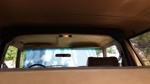 1984 Ford Bronco - Interior view of a 1984 Ford Bronco, looking forward through the windshield.