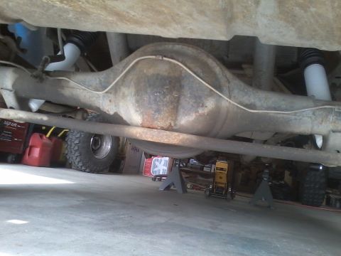 1978 Ford Bronco - Close-up of a vehicle's rear axle assembly, showing the differential and suspension components.