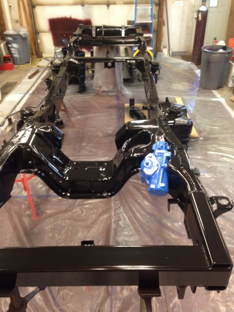 1993 Ford Bronco - Vehicle frame and steering gear assembly undergoing restoration or painting.