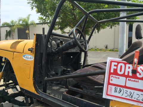 1968 Ford Mustang - A yellow off-road vehicle with a roll cage and "FOR SALE" sign is shown from the interior view.