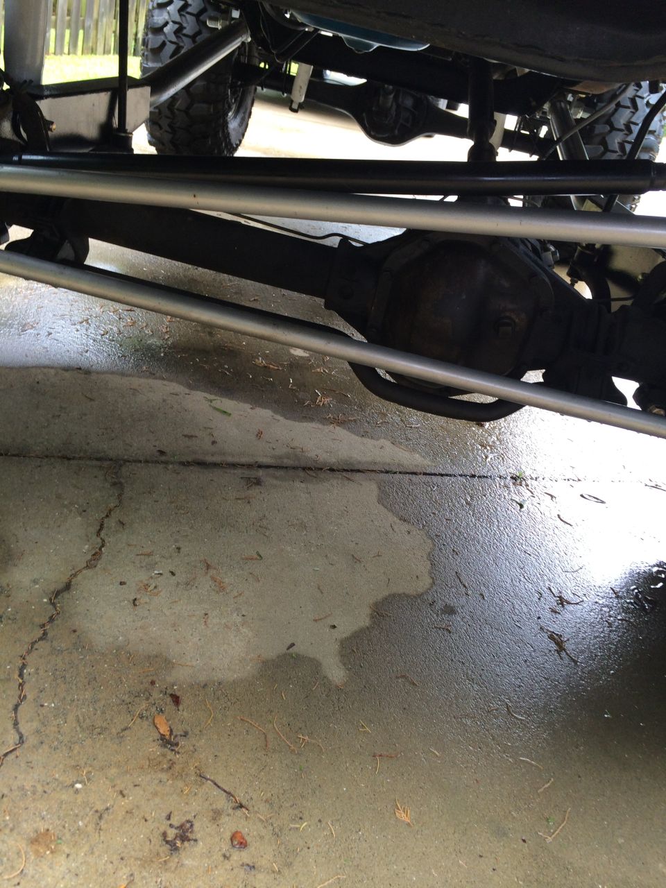 Undercarriage view showing suspension components and differential of a vehicle