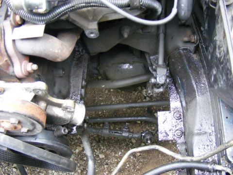 Engine bay components and steering linkage with oil leaks