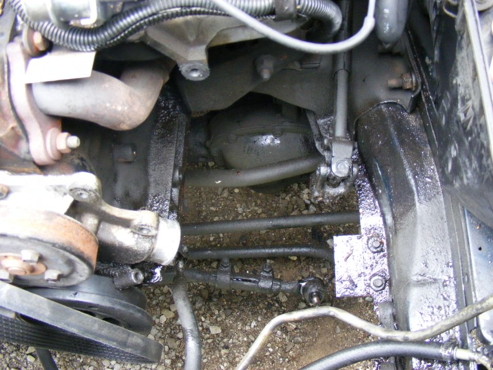 Engine bay components and steering linkage with oil leaks
