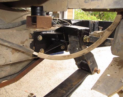 1990 Ford Bronco II - New shackle bracket to fit the 64'' Chevy leafs... puts the (extended) shackle about 3'' rearward of stock.