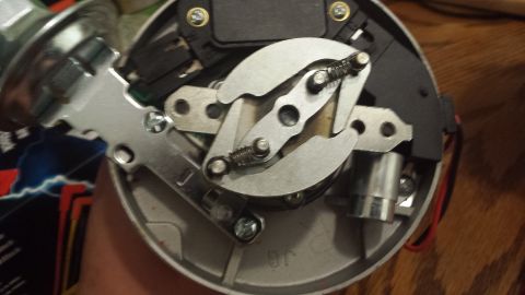 1984 Ford Bronco - A detailed view of a vehicle's distributor, highlighting its internal mechanical parts.