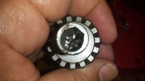 1984 Ford Bronco - A person is holding a specialized socket tool, likely for a specific automotive application.