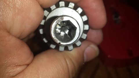 1984 Ford Bronco - A socket wrench head is shown in detail, with a hex opening visible.