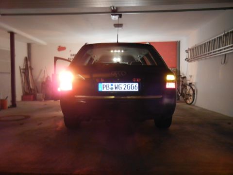 2003 Audi A6 - The rear of an Audi A6 Avant is shown in a garage with its brake lights illuminated.