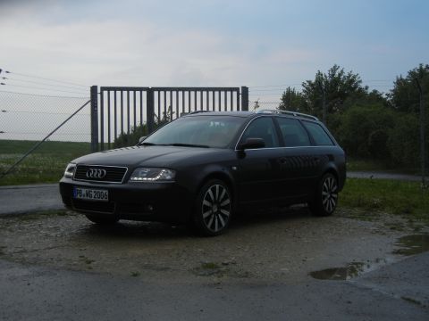 2003 Audi A6 - This black Audi A6 wagon features custom wheels and a license plate indicating the year 2006.